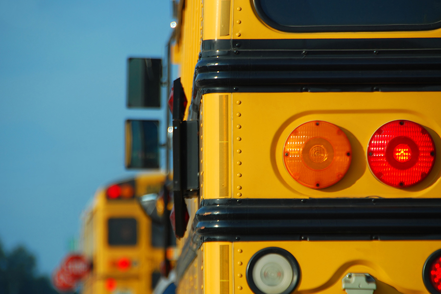 the taillights of a school bus symbolizing a charter school