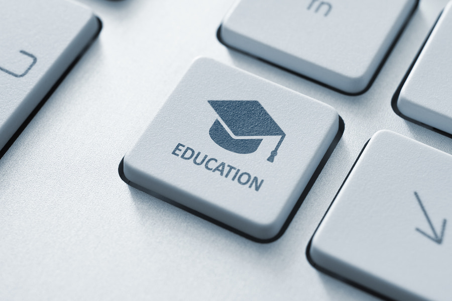a key on a keyboard labeled "education" symbolizing online tutoring