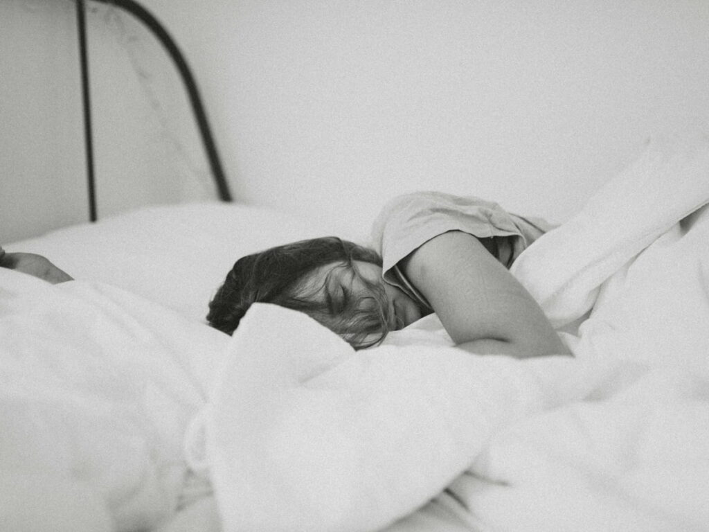 a woman with sleep apnea in bed