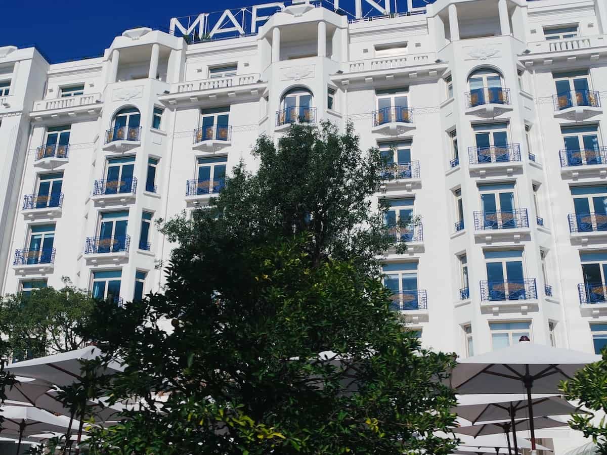 an exterior view of the hotel martinez in cannes france