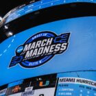 a scoreboard at a march madness ncaa basketball game