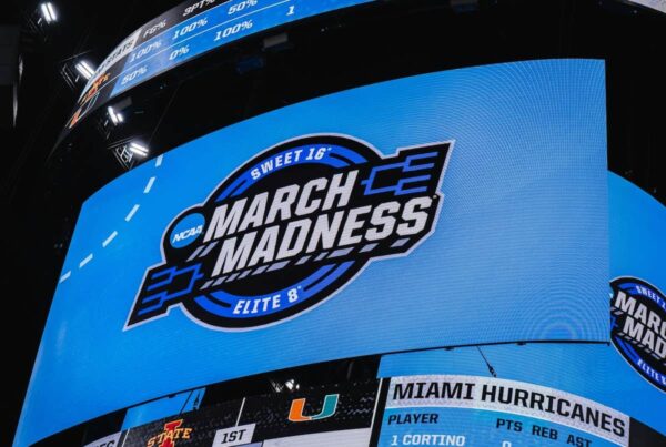 a scoreboard at a march madness ncaa basketball game