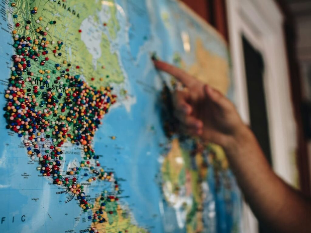 a travel agent points to a map