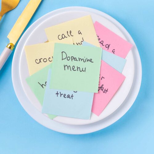a plate with a sticky note saying dopamine menu