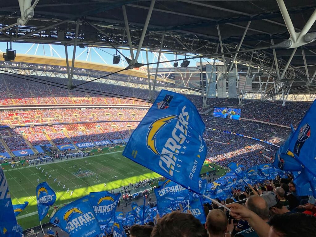 L.A. charger fans wave flags and watch a game played under the new 2025 nfl rules