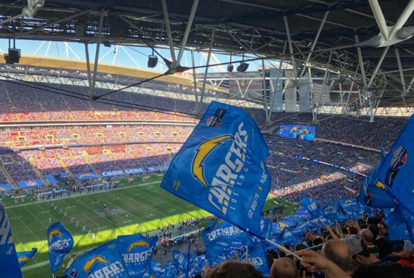 L.A. charger fans wave flags and watch a game played under the new 2025 nfl rules