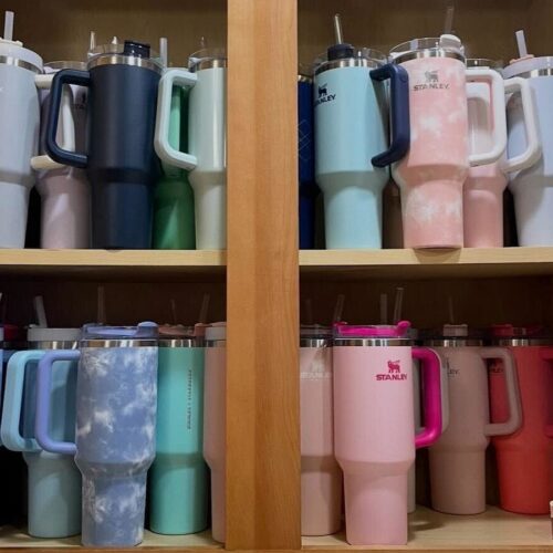 a collection of different colored stanley cups