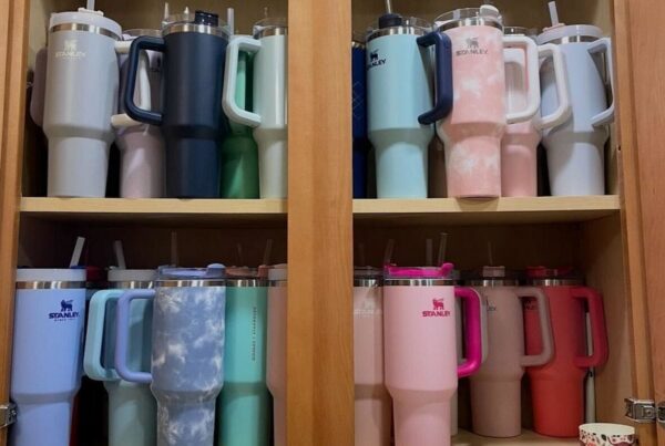 a collection of different colored stanley cups